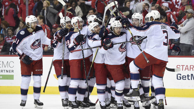 WASHINGTON, DC - JANUARY 12: Artemi Panarin #9 of the Columbus Blue Jackets celebrates with his teammates after scoring the game winning goal in overtime to defeat the Washington Capitals 2-1 at Capital One Arena on January 12, 2019 in Washington, DC.