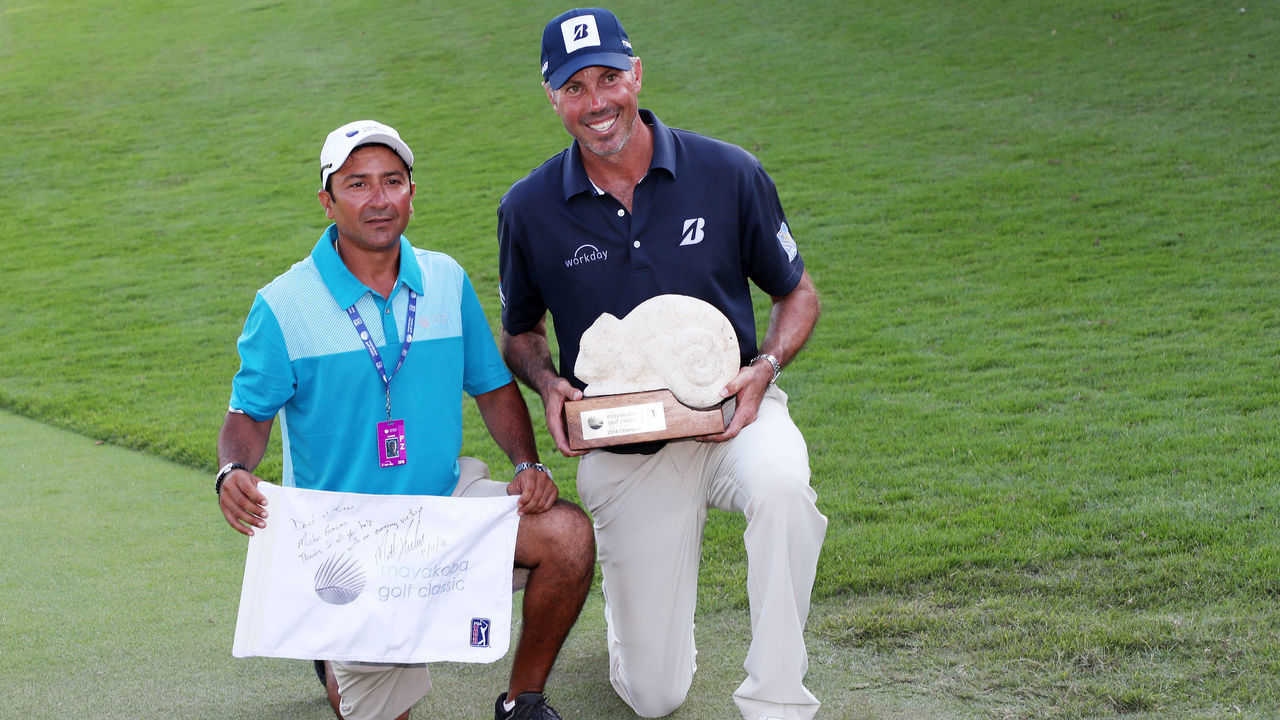 PLAYA DEL CARMEN, MEXICO - NOVEMBER 11: Matt Kuchar of the United States celebrates with caddie El Tucan on the 18th green after winning during the final round of the Mayakoba Golf Classic at El Camaleon Mayakoba Golf Course on November 11, 2018 in Playa del Carmen, Mexico.