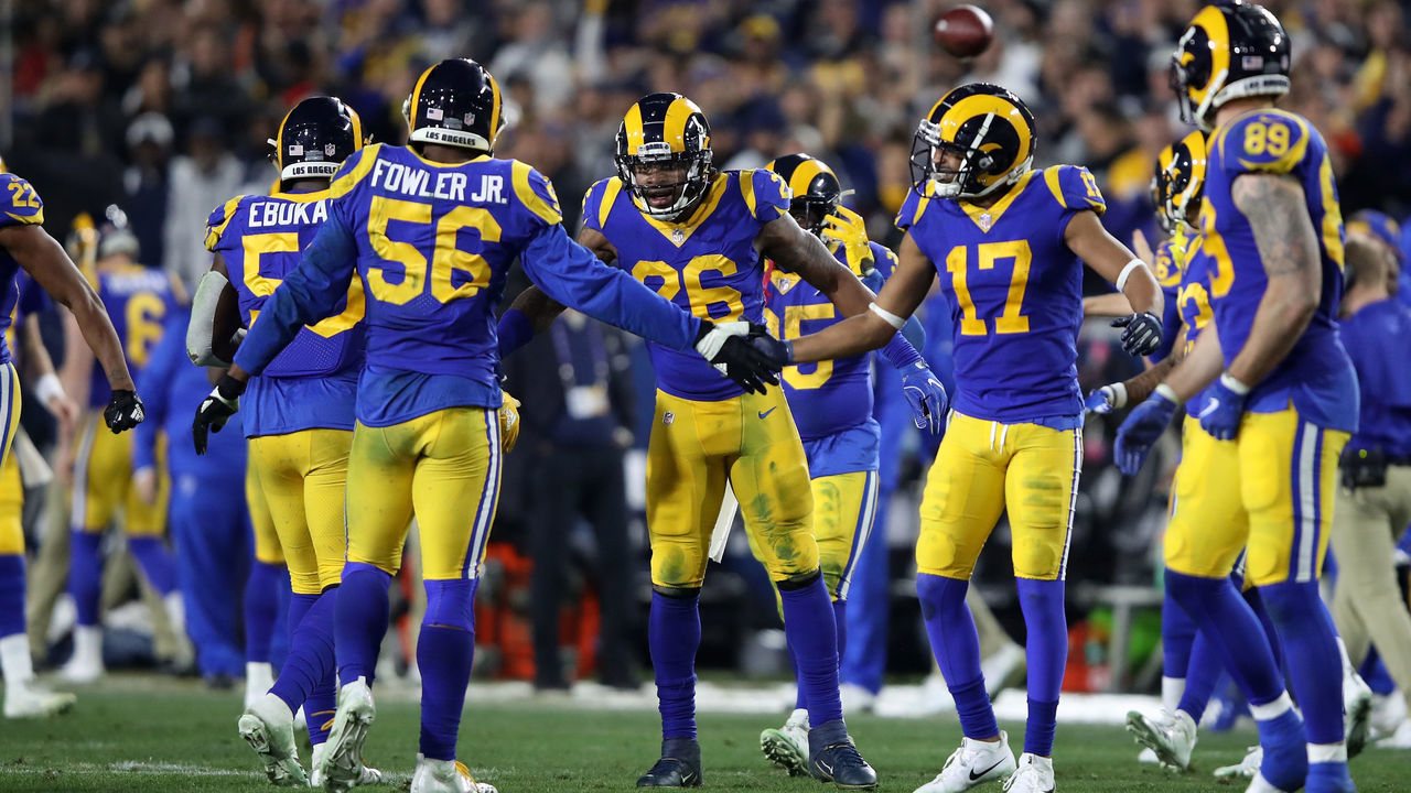 LOS ANGELES, CA - JANUARY 12: Dante Fowler #56 and Robert Woods #17 of the Los Angeles Rams celebrate after a stop in the second half against the Dallas Cowboys in the NFC Divisional Playoff game at Los Angeles Memorial Coliseum on January 12, 2019 in Los Angeles, California.