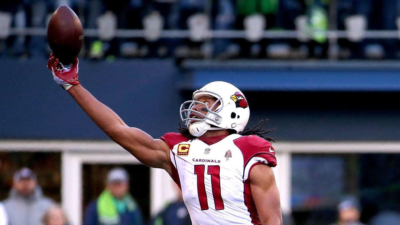 SEATTLE, WA - DECEMBER 30: Larry Fitzgerald #11 of the Arizona Cardinals reaches for a pass against Justin Coleman #28 of the Seattle Seahawks in the second quarter during their game at CenturyLink Field on December 30, 2018 in Seattle, Washington.