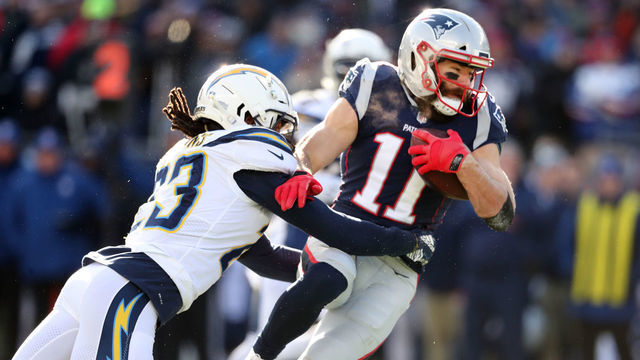 FOXBOROUGH, MA - JANUARY 13: New England Patriots' Julian Edelman runs with the ball during the first quarter. The New England Patriots host the Los Angeles Chargers in an NFL AFC Divisional Playoff game at Gillette Stadium in Foxborough, MA on Jan. 13, 2019.