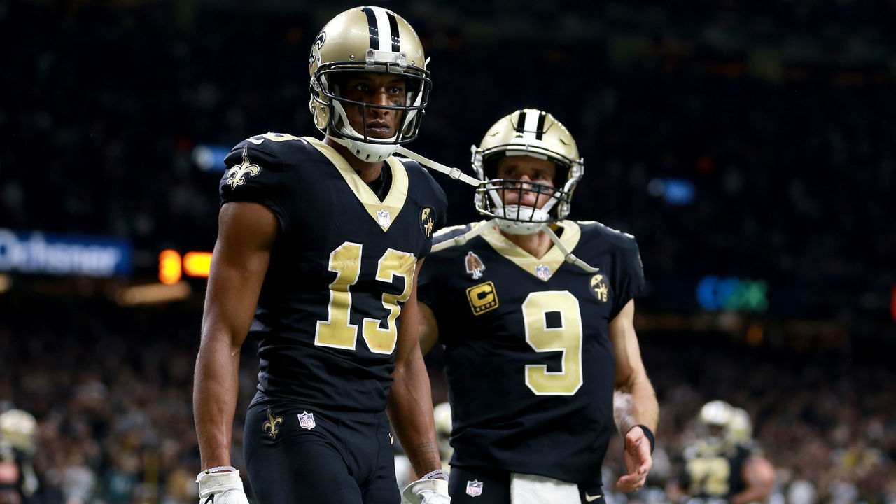 NEW ORLEANS, LOUISIANA - JANUARY 13: Michael Thomas #13 and Drew Brees #9 of the New Orleans Saints celebrate their third quarter touchdown against the Philadelphia Eagles in the NFC Divisional Playoff Game at Mercedes Benz Superdome on January 13, 2019 in New Orleans, Louisiana.