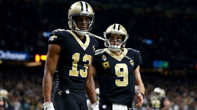 NEW ORLEANS, LOUISIANA - JANUARY 13: Michael Thomas #13 and Drew Brees #9 of the New Orleans Saints celebrate their third quarter touchdown against the Philadelphia Eagles in the NFC Divisional Playoff Game at Mercedes Benz Superdome on January 13, 2019 in New Orleans, Louisiana.