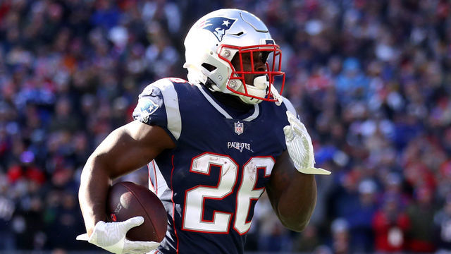 FOXBOROUGH, MASSACHUSETTS - JANUARY 13: Sony Michel #26 of the New England Patriots carries the ball during the second quarter in the AFC Divisional Playoff Game against the Los Angeles Chargers at Gillette Stadium on January 13, 2019 in Foxborough, Massachusetts.