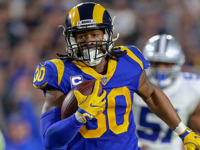 LOS ANGELES, CA - JANUARY 12: Los Angeles Rams running back Todd Gurley (30) runs for a touchdown during the NFC Divisional Football game between the Dallas Cowboys and the Los Angeles Rams on January 12, 2019 at the Los Angeles Memorial Coliseum in Los Angeles, CA.