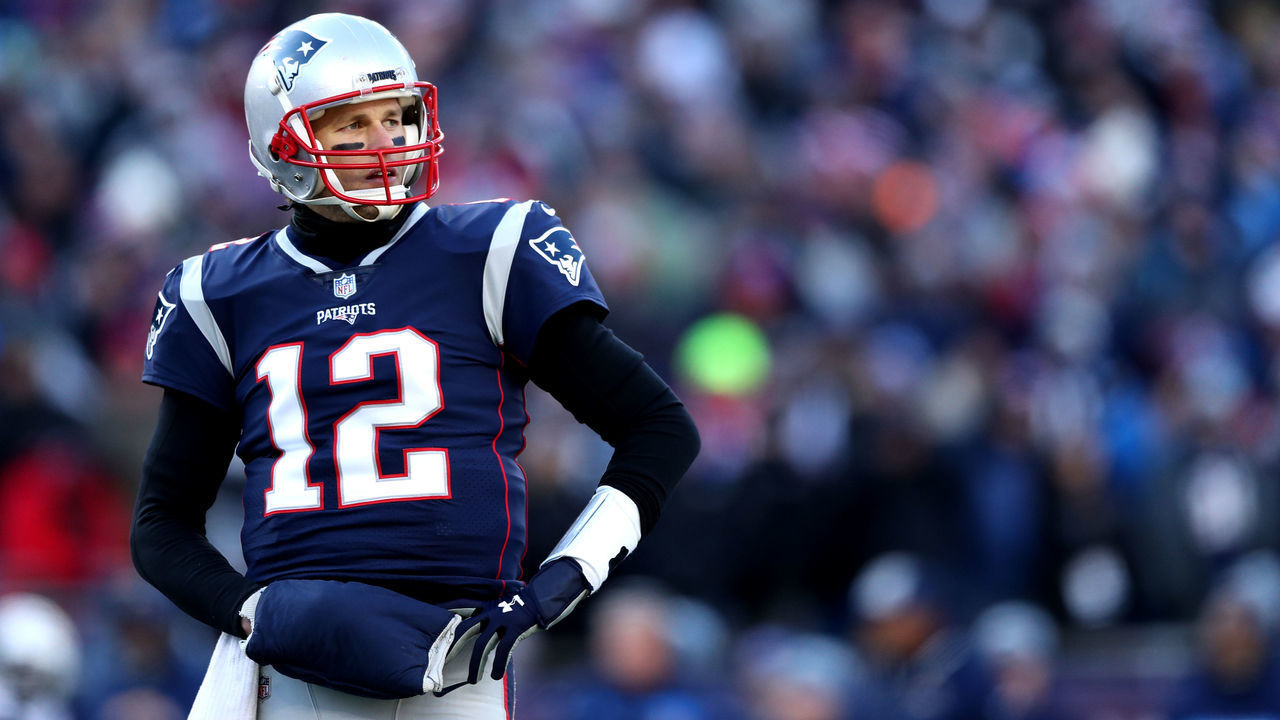 FOXBOROUGH, MASSACHUSETTS - JANUARY 13: Tom Brady #12 of the New England Patriots looks on during the second quarter in the AFC Divisional Playoff Game against the Los Angeles Chargers at Gillette Stadium on January 13, 2019 in Foxborough, Massachusetts.