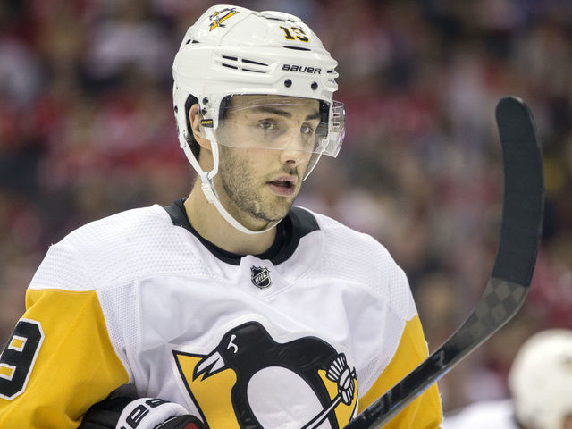 WASHINGTON, DC - DECEMBER 19: Pittsburgh Penguins center Derick Brassard (19) in the face off circle during a NHL game between the Washington Capitals and the Pittsburgh Penguins on December 19, 2018, at Capital One Arena, in Washington, D.C.