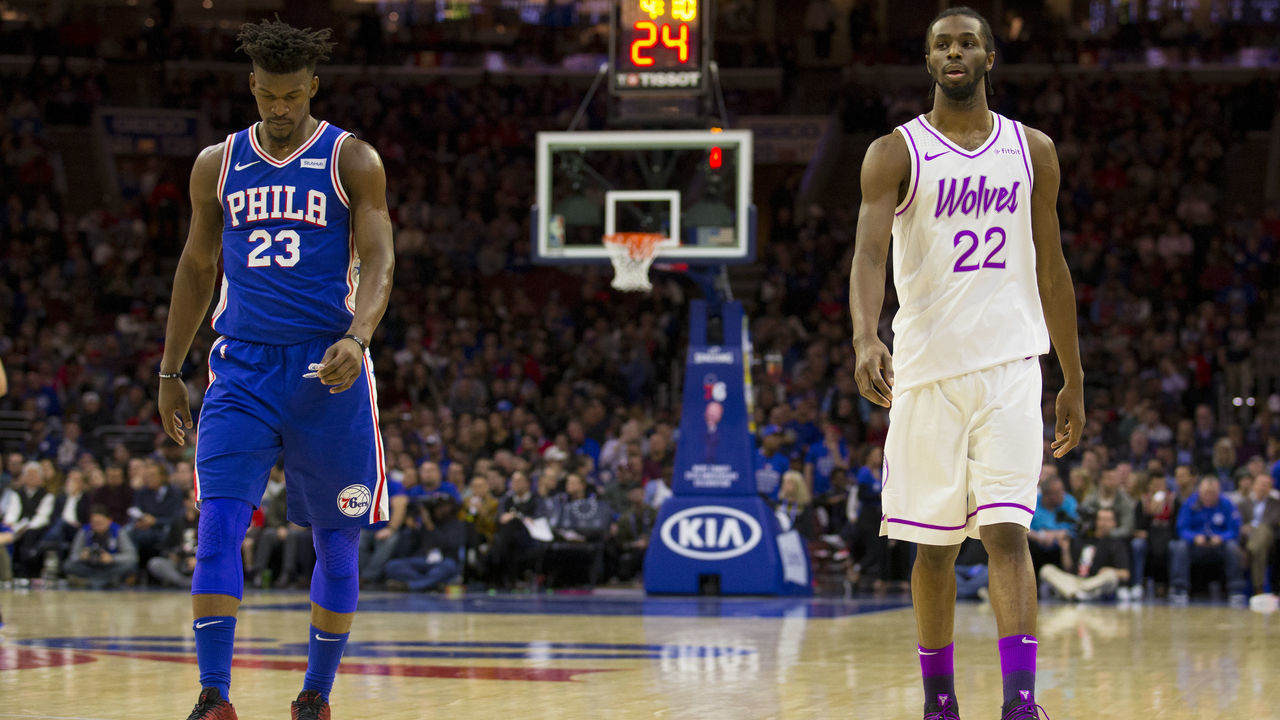 PHILADELPHIA, PA - JANUARY 15: Jimmy Butler #23 of the Philadelphia 76ers and Andrew Wiggins #22 of the Minnesota Timberwolves walk down the court in the third quarter at the Wells Fargo Center on January 15, 2019 in Philadelphia, Pennsylvania. The 76ers defeated the Timberwolves 149-107.