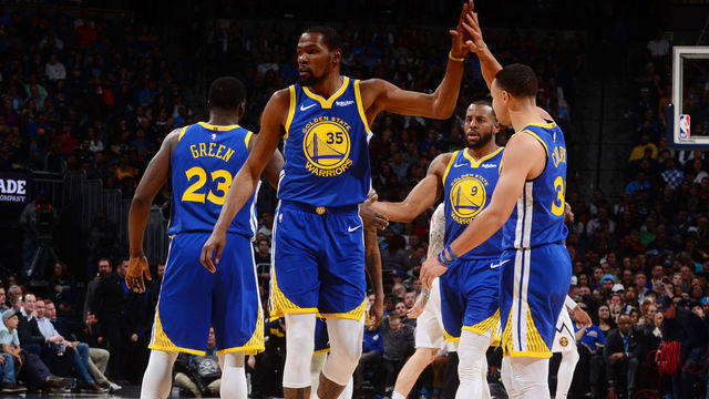 DENVER, CO - JANUARY 15: Kevin Durant #35 hi-fives Stephen Curry #30 of the Golden State Warriors on January 15, 2019 at the Pepsi Center in Denver, Colorado. NOTE TO USER: User expressly acknowledges and agrees that, by downloading and/or using this Photograph, user is consenting to the terms and conditions of the Getty Images License Agreement. Mandatory Copyright Notice: Copyright 2019 NBAE