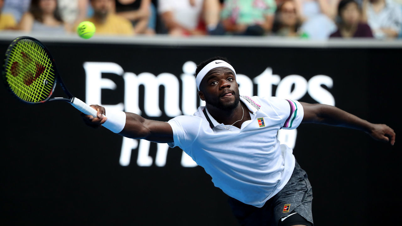 MELBOURNE, AUSTRALIA - JANUARY 16: Frances Tiafoe of France plays a forehand in his second round match against Kevin Anderson of South Africa during day three of the 2019 Australian Open at Melbourne Park on January 16, 2019 in Melbourne, Australia.