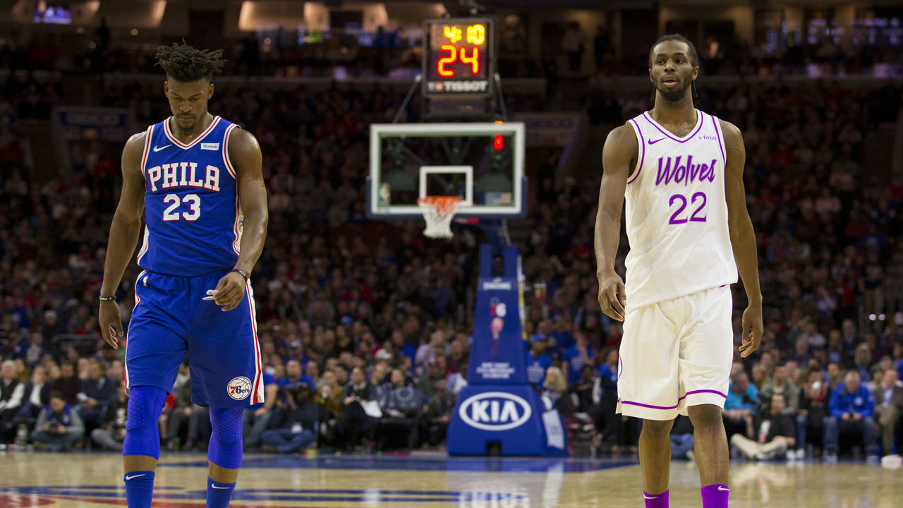 PHILADELPHIA, PA - JANUARY 15: Jimmy Butler #23 of the Philadelphia 76ers and Andrew Wiggins #22 of the Minnesota Timberwolves walk down the court in the third quarter at the Wells Fargo Center on January 15, 2019 in Philadelphia, Pennsylvania. The 76ers defeated the Timberwolves 149-107.