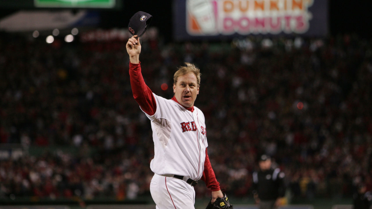 Boston Red Sox pitcher Curt Schilling walks off the field after only allowing one run against the Colorado Rockies during the second game of the World Series at Fenway Park in Boston, Thursday., Oct. 25, 2007.