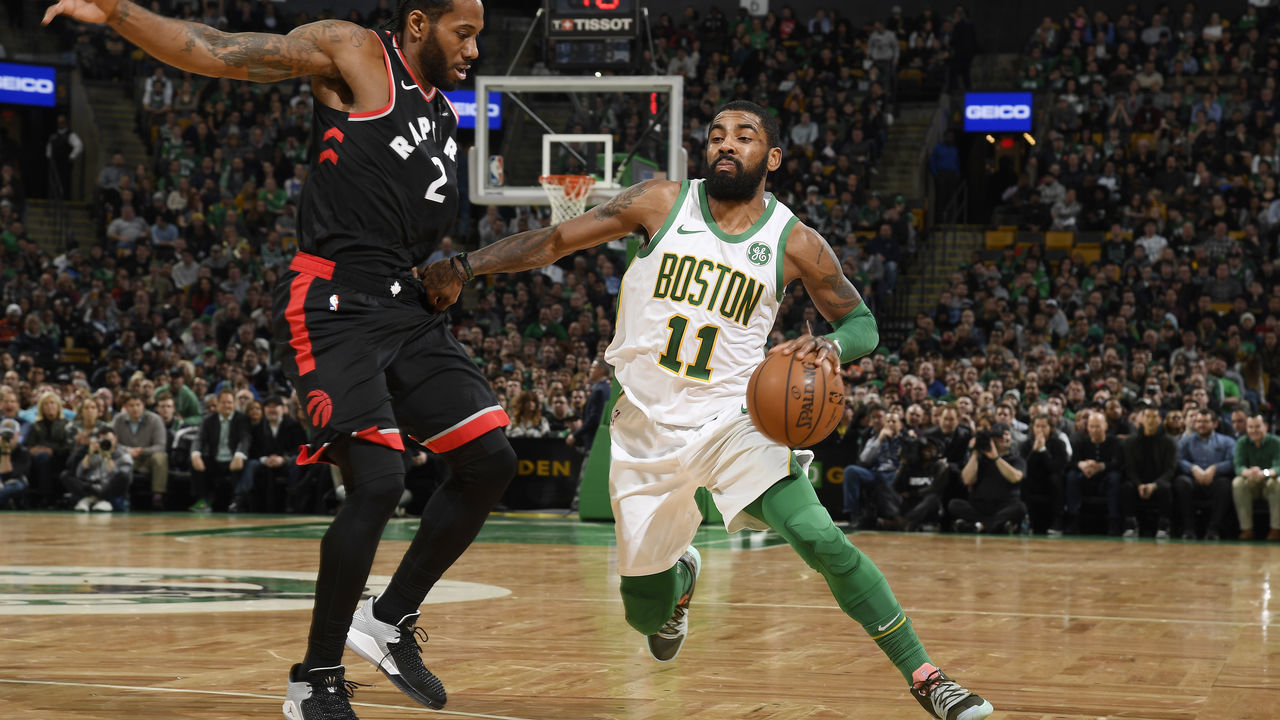 BOSTON, MA - JANUARY 16: Kawhi Leonard #2 of the Toronto Raptors defends against Kyrie Irving #11 of the Boston Celtics on January 16, 2019 at the TD Garden in Boston, Massachusetts. Mandatory Copyright Notice: Copyright 2019 NBAE