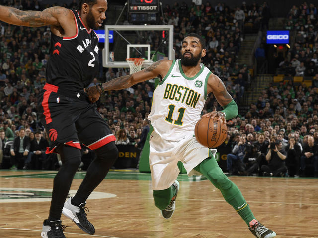 BOSTON, MA - JANUARY 16: Kawhi Leonard #2 of the Toronto Raptors defends against Kyrie Irving #11 of the Boston Celtics on January 16, 2019 at the TD Garden in Boston, Massachusetts. Mandatory Copyright Notice: Copyright 2019 NBAE