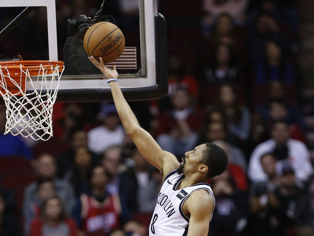 HOUSTON, TEXAS - JANUARY 16: Spencer Dinwiddie #8 of the Brooklyn Nets drives past PJ Tucker #17 of the Houston Rockets during the fourth quarter at Toyota Center on January 16, 2019 in Houston, Texas.