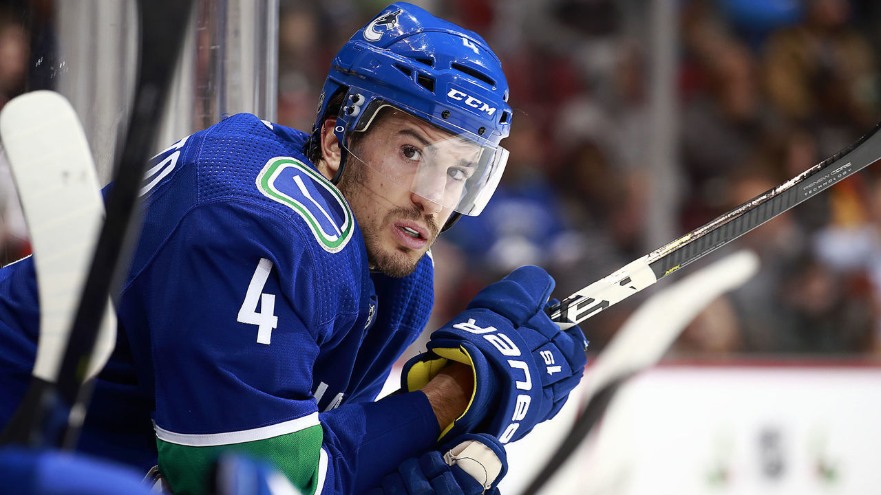 VANCOUVER, BC - DECEMBER 4: Michael Del Zotto #4 of the Vancouver Canucks looks on from the bench during their NHL game against the Minnesota Wild at Rogers Arena December 4, 2018 in Vancouver, British Columbia, Canada. 'n