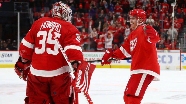 DETROIT, MI - DECEMBER 29: Gustav Nyquist #14 of the Detroit Red Wings celebrates a 3-2 shootout win over the New York Rangers with Jimmy Howard #35 at Little Caesars Arena on December 29, 2017 in Detroit, Michigan.