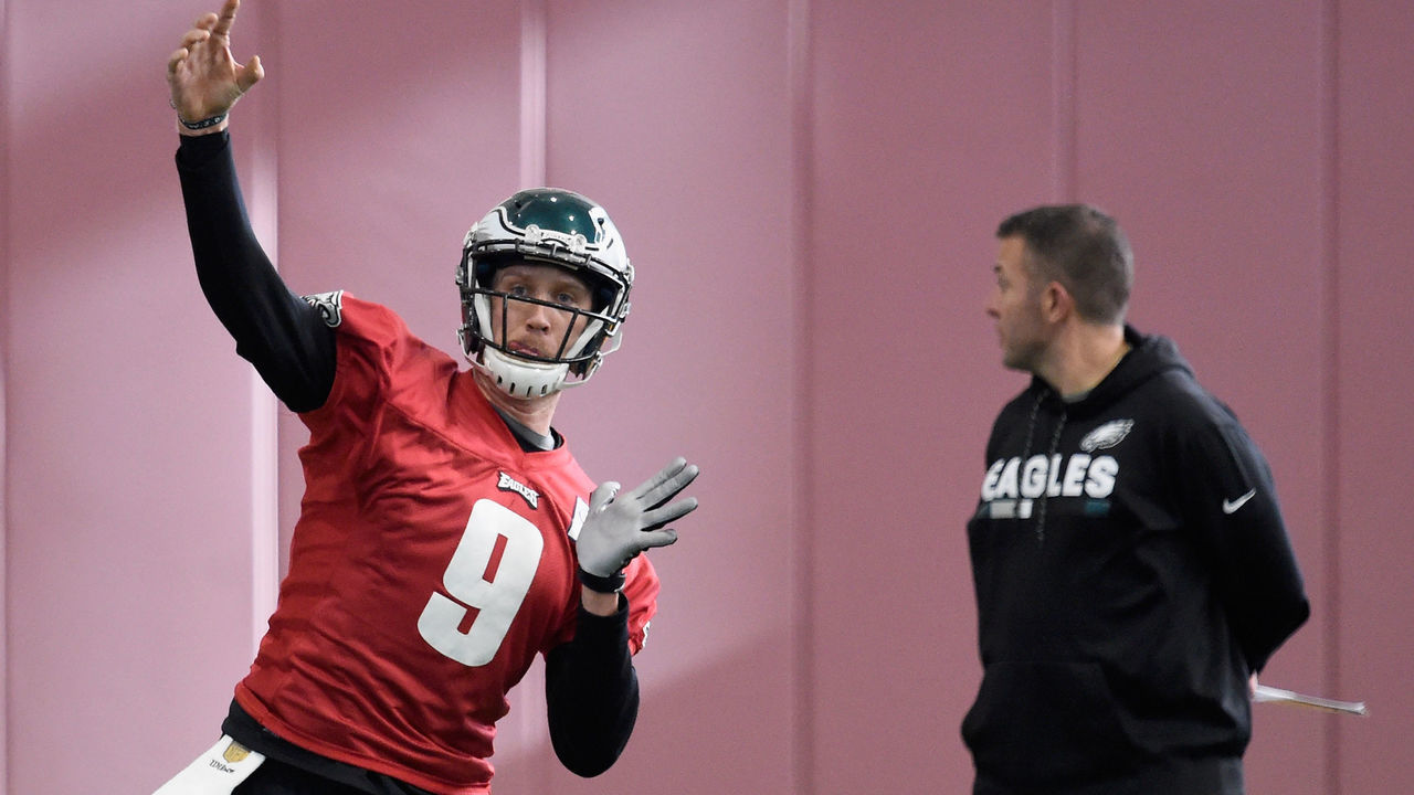 BLOOMINGTON, MN - JANUARY 31: Carson Wentz #11 and quarterbacks coach John DeFilippo of the Philadelphia Eagles looks on as teammate Nick Foles #9 passes the ball during Super Bowl LII practice on January 31, 2018 at the University of Minnesota in Minneapolis, Minnesota. The Philadelphia Eagles will face the New England Patriots in Super Bowl LII on February 4th.