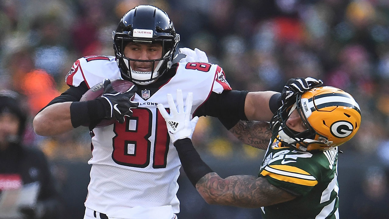 GREEN BAY, WISCONSIN - DECEMBER 09: Austin Hooper #81 of the Atlanta Falcons is pursued by Josh Jones #27 of the Green Bay Packers during a game at Lambeau Field on December 09, 2018 in Green Bay, Wisconsin. The Packers defeated the Falcons 34-20.