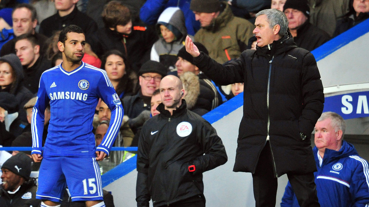 Chelsea's Portuguese manager Jose Mourinho (R) gives instructions to Chelsea's Egyptian midfielder Mohamed Salah (L) during the English Premier League football match between Chelsea and Newcastle United at Stamford Bridge in west London on February 8, 2014. Chelsea won the game 3-0. AFP PHOTO / GLYN KIRK RESTRICTED TO EDITORIAL USE. No use with unauthorized audio, video, data, fixture lists, club/league logos or live services. Online in-match use limited to 45 images, no video emulation. No use in betting, games or single club/league/player publications.