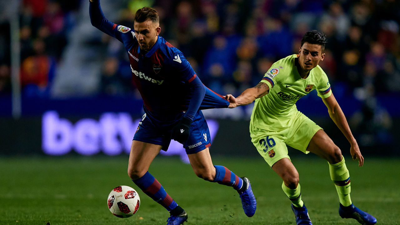 VALENCIA, SPAIN - JANUARY 10: Borja Mayoral (L) of Levante UD competes for the ball with Chumi of FC Barcelona during the Copa del Rey Round of 16 match between Levante UD and FC Barcelona at Ciutat de Valencia on January 10, 2019 in Valencia, Spain.