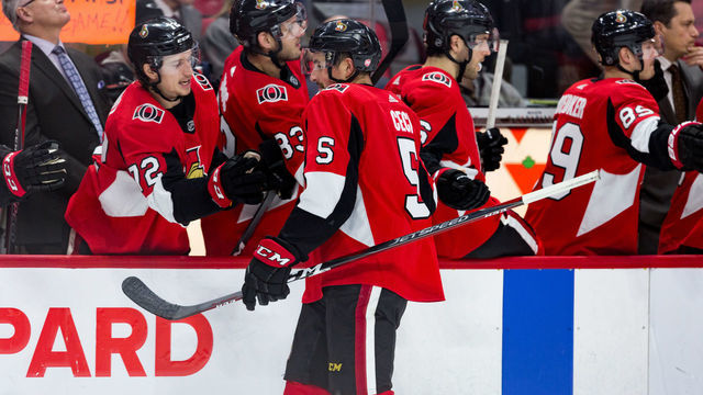 OTTAWA, ON - JANUARY 16: Ottawa Senators Defenceman Cody Ceci (5) skates by the bench to celebrate a goal during third period National Hockey League action between the Colorado Avalanche and Ottawa Senators on January 16, 2019, at Canadian Tire Centre in Ottawa, ON, Canada.