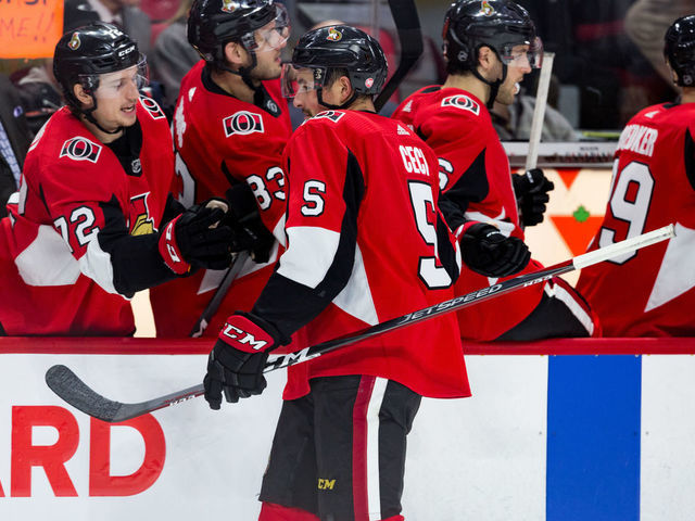 OTTAWA, ON - JANUARY 16: Ottawa Senators Defenceman Cody Ceci (5) skates by the bench to celebrate a goal during third period National Hockey League action between the Colorado Avalanche and Ottawa Senators on January 16, 2019, at Canadian Tire Centre in Ottawa, ON, Canada.