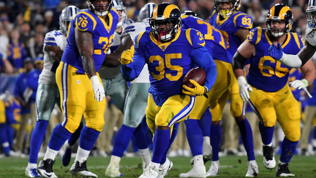 LOS ANGELES, CA - JANUARY 12: C.J. Anderson #35 of the Los Angeles Rams runs with the ball in the first half against the Dallas Cowboys in the NFC Divisional Playoff game at Los Angeles Memorial Coliseum on January 12, 2019 in Los Angeles, California.