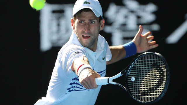 19th January 2019, Melbourne Park, Melbourne, Australia; Australian Open Tennis, day 6; Novak Djokovic of Serbia returns the ball against Denis Shapovalov of Canada