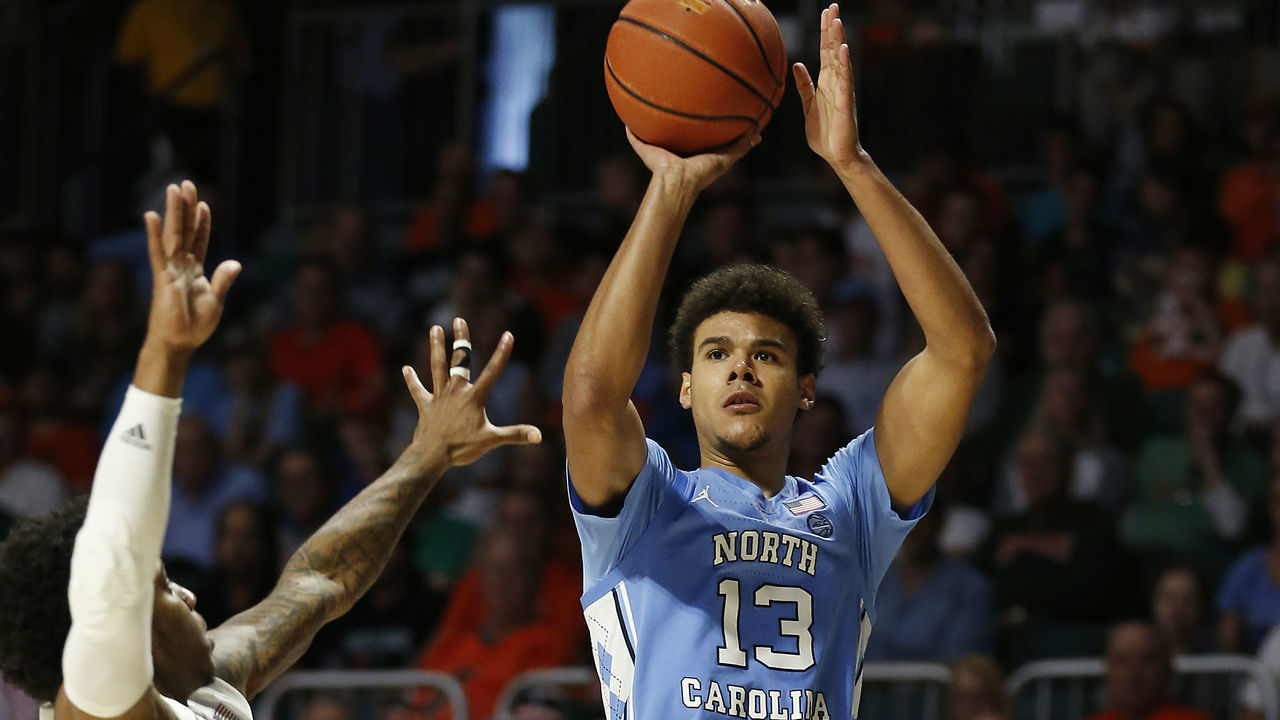 MIAMI, FLORIDA - JANUARY 19: Cameron Johnson #13 of the North Carolina Tar Heels shoots a three pointer against the Miami Hurricanes during the second half at Watsco Center on January 19, 2019 in Miami, Florida.