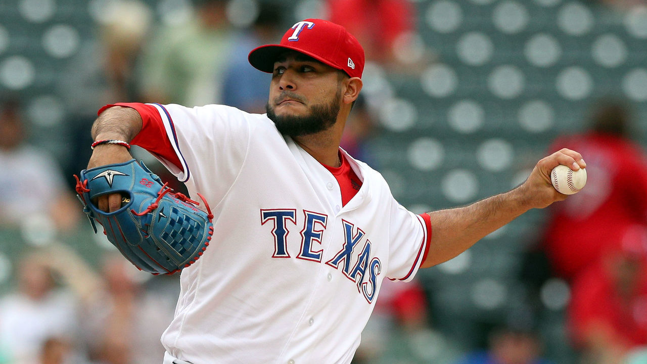 ARLINGTON, TX - SEPTEMBER 23: Martin Perez #33 of the Texas Rangers pitches in the first inning against the Seattle Mariners at Globe Life Park in Arlington on September 23, 2018 in Arlington, Texas.