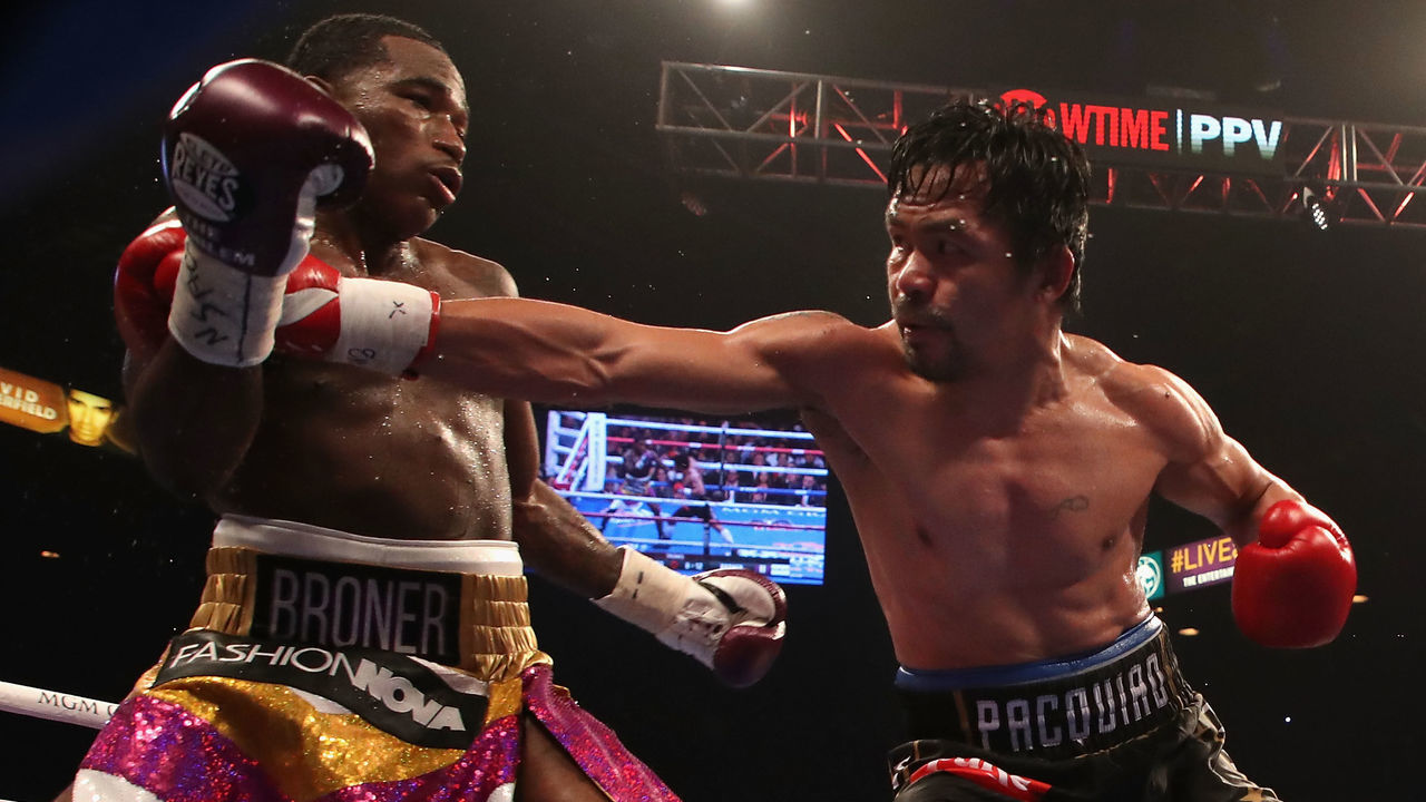 LAS VEGAS, NEVADA - JANUARY 19: Manny Pacquiao (R) throws a right on Adrien Broner during the WBA welterweight championship at MGM Grand Garden Arena on January 19, 2019 in Las Vegas, Nevada.