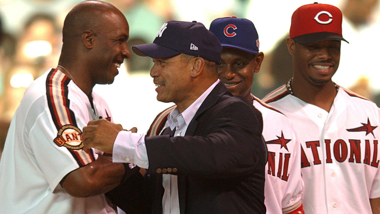 Reggie Jackson is greeted by Barry Bonds, Sammy Sosa and Ken Griffey Jr. as he is saluted as one of the members of the 500 home run club prior to the start of the 2004 Home Run Derby at Minute Maid Park in Houston, Texas July 12, 2004.