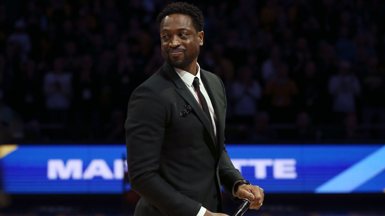 MILWAUKEE, WISCONSIN - JANUARY 20: Former Marquette Golden Eagles player Dwyane Wade speaks to the crowd during a ceremony at halftime of the game between the Providence Friars and Marquette Golden Eagles at the Fiserv Forum on January 20, 2019 in Milwaukee, Wisconsin.
