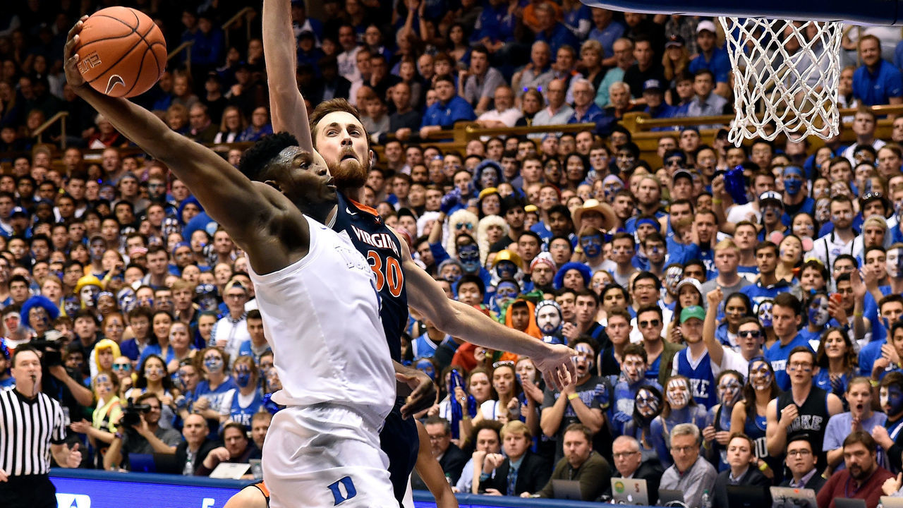 DURHAM, NORTH CAROLINA - JANUARY 19: Zion Williamson #1 of the Duke Blue Devils dunis over Jay Huff #30 of the Virginia Cavaliers during their game at Cameron Indoor Stadium on January 19, 2019 in Durham, North Carolina. Duke won 72-70.