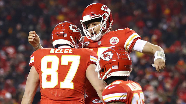 KANSAS CITY, MISSOURI - JANUARY 20: Patrick Mahomes #15 of the Kansas City Chiefs celebrates with Travis Kelce #87 after scoring a touchdown in the third quarter against the New England Patriots during the AFC Championship Game at Arrowhead Stadium on January 20, 2019 in Kansas City, Missouri.
