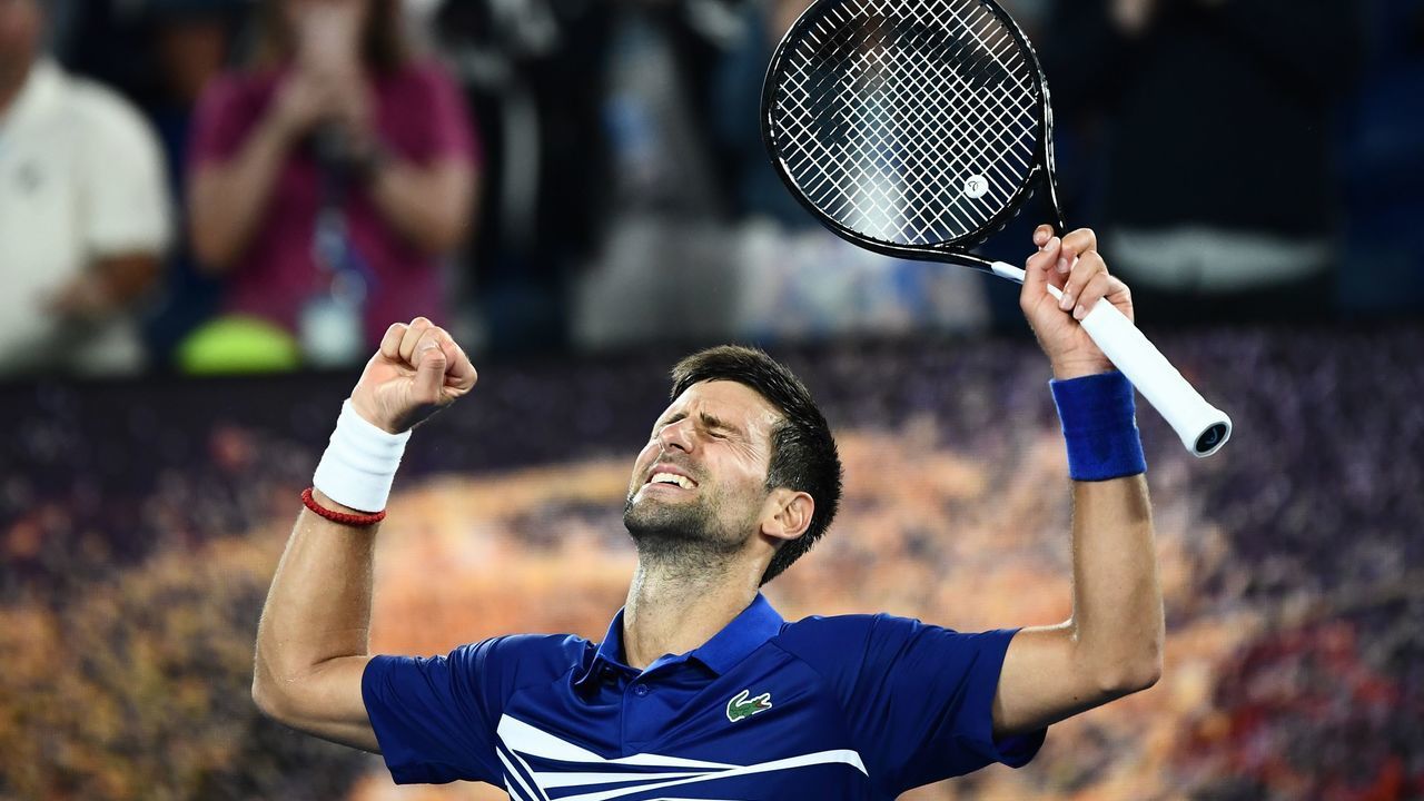 Serbia's Novak Djokovic celebrates his victory against Russia's Daniil Medvedev during their men's singles match on day eight of the Australian Open tennis tournament in Melbourne early on January 22, 2019.