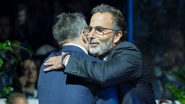 TAMPA, FL - JANUARY 13: Head Coach John Tortorella of the Columbus Blue Jackets hugs Martin St. Louis #26 jersey during the retirement ceremony before the game between the Tampa Bay Lightning and the Columbus Blue Jackets at Amalie Arena on January 13, 2017 in Tampa, Florida.
