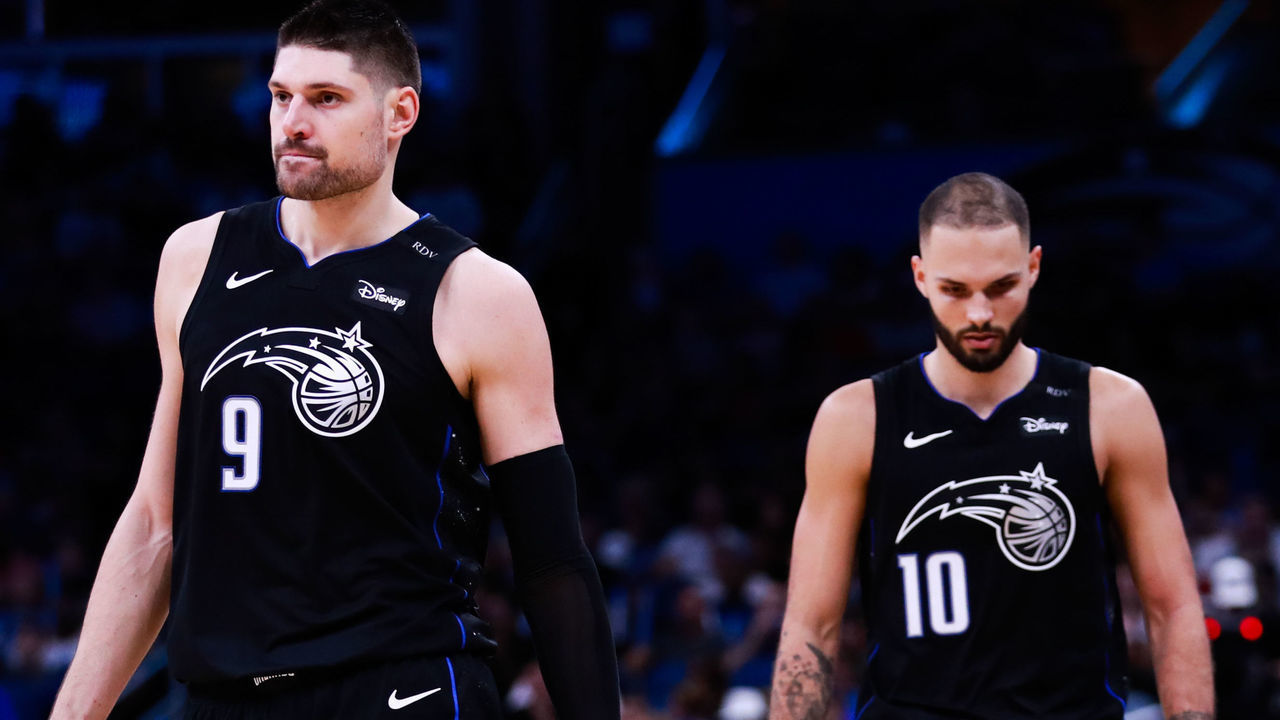 ORLANDO, FLORIDA - DECEMBER 30: Nikola Vucevic #9 and Evan Fournier #10 of the Orlando Magic walk up court between plays against the Detroit Pistons in the fourth quarter at Amway Center on December 30, 2018 in Orlando, Florida.