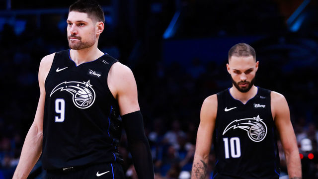 ORLANDO, FLORIDA - DECEMBER 30: Nikola Vucevic #9 and Evan Fournier #10 of the Orlando Magic walk up court between plays against the Detroit Pistons in the fourth quarter at Amway Center on December 30, 2018 in Orlando, Florida.