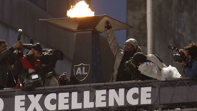 OAKLAND, CA - DECEMBER 24: Oakland Raiders' Marshawn Lynch (24) lights the Al Davis eternal flame before their game against the Denver Broncos for their NFL game at the Coliseum in Oakland, Calif., on Monday, Dec. 24, 2018.