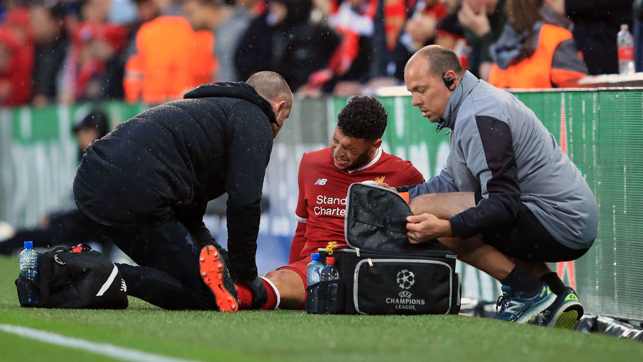 LIVERPOOL, ENGLAND - APRIL 24: Alex Oxlade-Chamberlain of Liverpool is treated for an injury during the UEFA Champions League Semi Final First Leg match between Liverpool and A.S. Roma at Anfield on April 24, 2018 in Liverpool, United Kingdom.