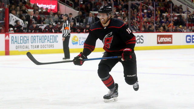 RALEIGH, NC - JANUARY 11: Dougie Hamilton #19 of the Carolina Hurricanes skates for position on the ice during an NHL game against the Buffalo Sabres on January 11 ,2019 at PNC Arena in Raleigh, North Carolina.