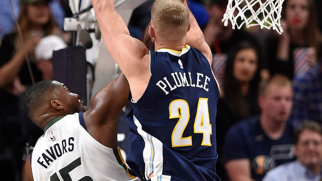 SALT LAKE CITY, UT - OCTOBER 18: Derrick Favors #15 of the Utah Jazz scores in the second half past the defense of Mason Plumlee #24 of the Denver Nuggets during the 106-96 win by the Jazz at Vivint Smart Home Arena on October 18, 2017 in Salt Lake City, Utah.