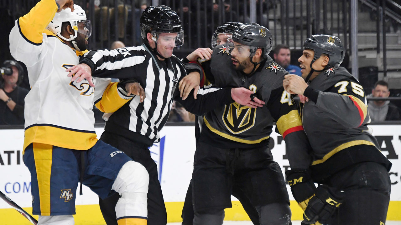 LAS VEGAS, NEVADA - JANUARY 23: Linesman Brandon Gawryletz tries to separate P.K. Subban #76 of the Nashville Predators from Pierre-Edouard Bellemare #41 and Ryan Reaves #75 of the Vegas Golden Knights in the second period of their game at T-Mobile Arena on January 23, 2019 in Las Vegas, Nevada.