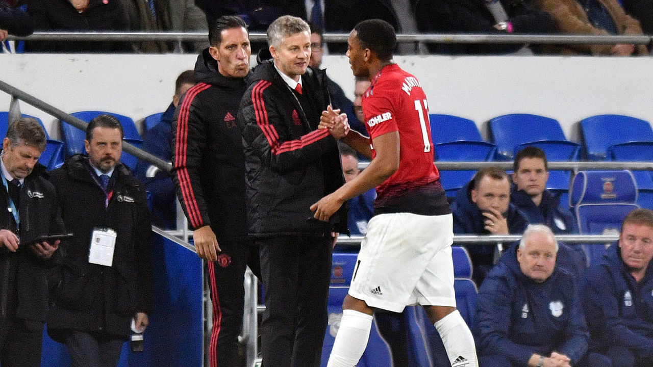 Manchester United's interim manager Ole Gunnar Solskjaer (left) and Anthony Martial Cardiff City v Manchester United - Premier League - Cardiff City Stadium 22-12-2018 .