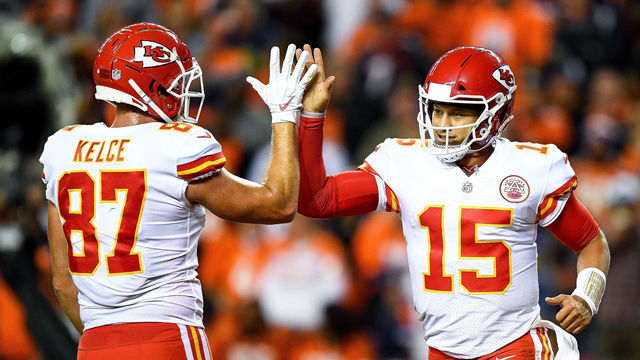 DENVER, CO - OCTOBER 1: Quarterback Patrick Mahomes #15 of the Kansas City Chiefs celebrates with tight end Travis Kelce #87 after scoring a second quarter rushing touchdown against the Denver Broncos at Broncos Stadium at Mile High on October 1, 2018 in Denver, Colorado.