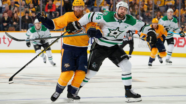 NASHVILLE, TN - DECEMBER 27: Jamie Benn #14 of the Dallas Stars skates against Ryan Ellis #4 of the Nashville Predators at Bridgestone Arena on December 27, 2018 in Nashville, Tennessee.