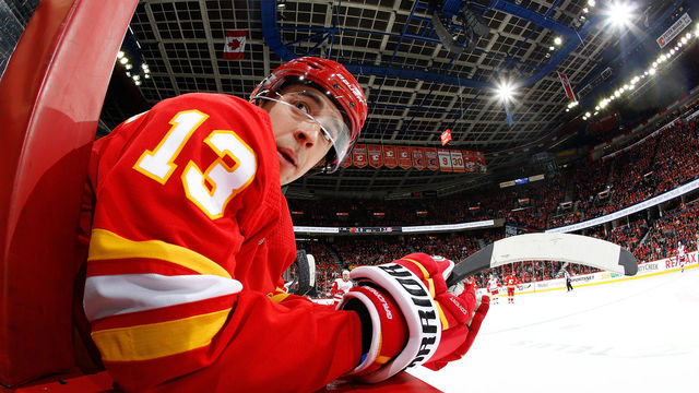 CALGARY, AB - JANUARY 18: Johnny Gaudreau #13 of the Calgary Flames watches from the bench against the Detroit Red Wings during an NHL game on January 18, 2019 at the Scotiabank Saddledome in Calgary, Alberta, Canada.