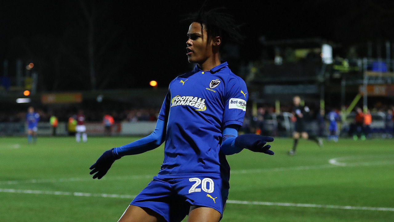 KINGSTON UPON THAMES, ENGLAND - JANUARY 26: Toby Sibbick of AFC Wimbledon celebrates after scoring his team's fourth goal during the FA Cup Fourth Round match between AFC Wimbledon and West Ham United at The Cherry Red Records Stadium on January 26, 2019 in Kingston upon Thames, United Kingdom.